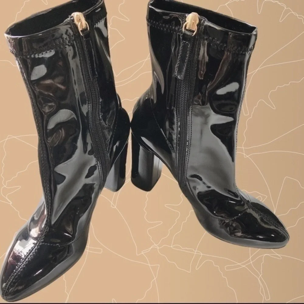 Black patent leather ankle boots